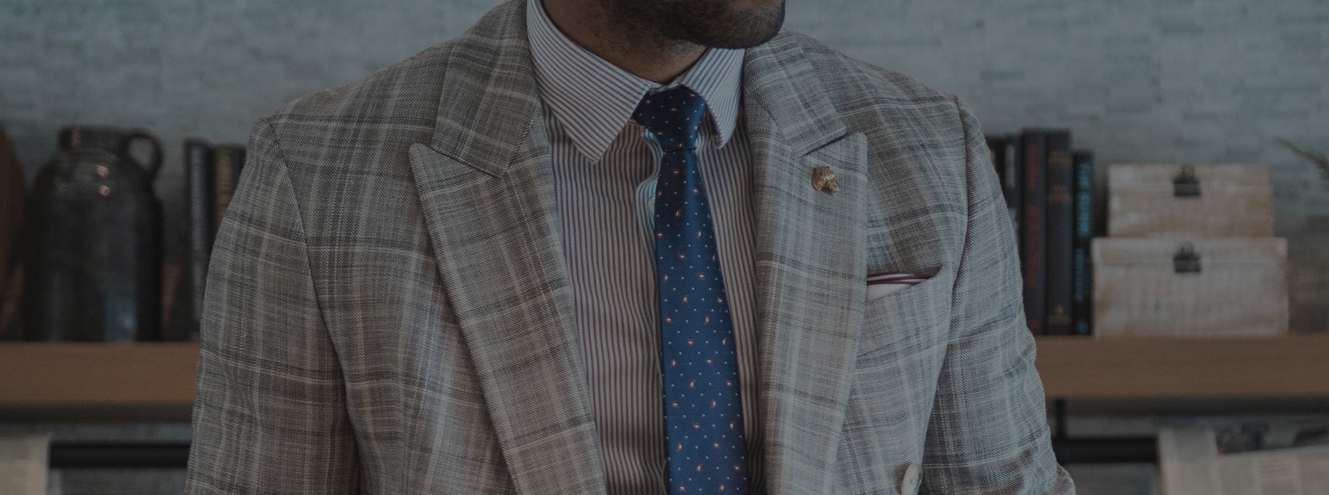 Man wearing a suit and tie in an office environment