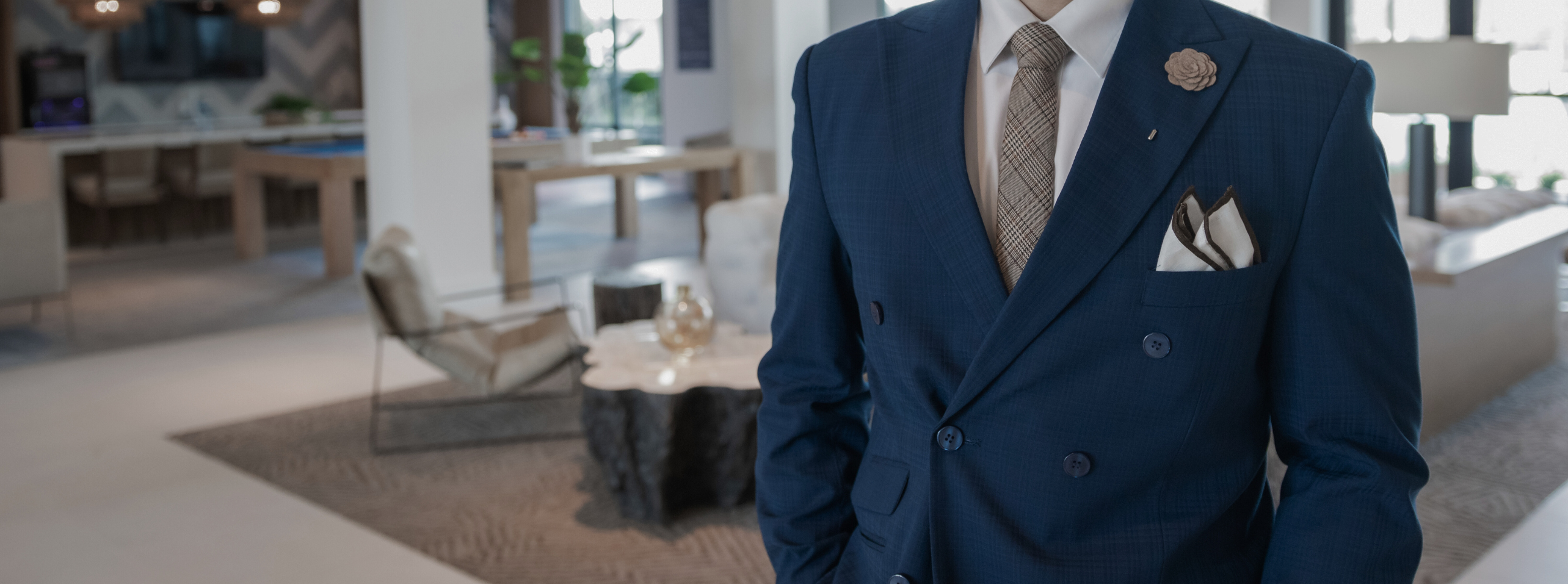 A gentleman standing in a navy blue suit