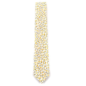 The floral marigold yellow tie laid out