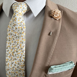 Model posing in the floral marigold yellow tie