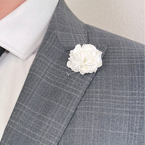 White Rose Lapel Pin over a Charcoal Grey Suit