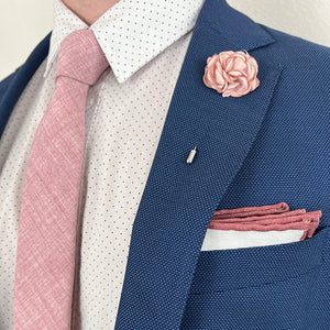 Blush Rose Lapel Pin with a Blue Suit