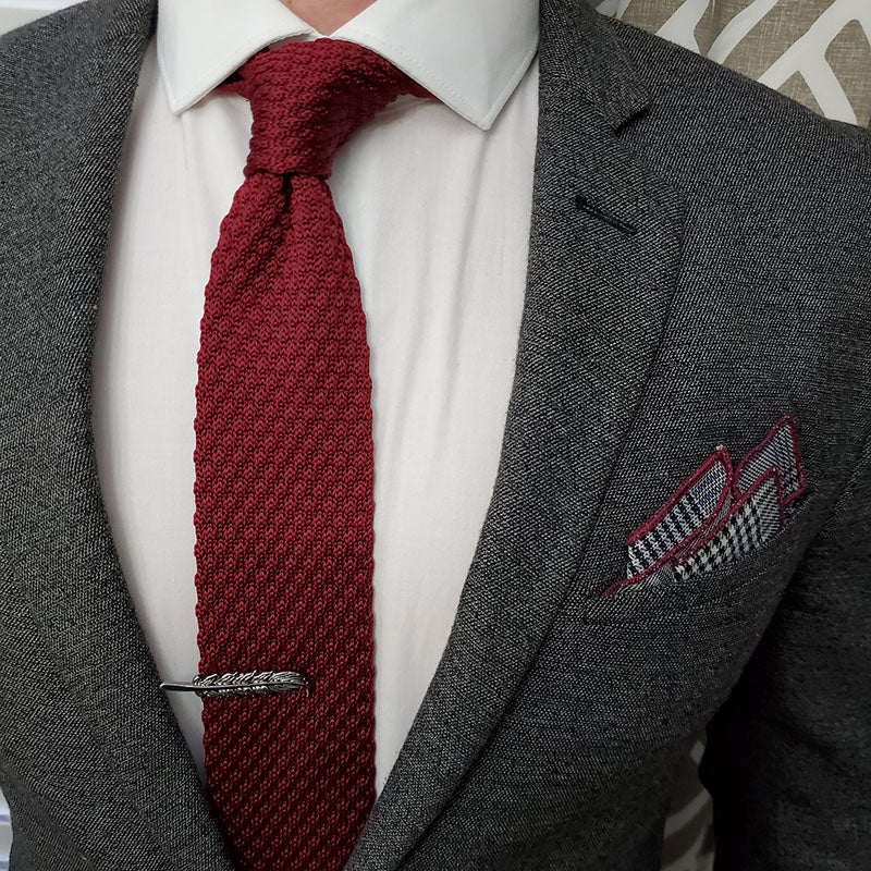 red tie suit